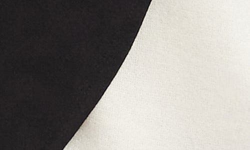 Karen Kane Colorblock Turtleneck Crossover Hem Knit Top In Black