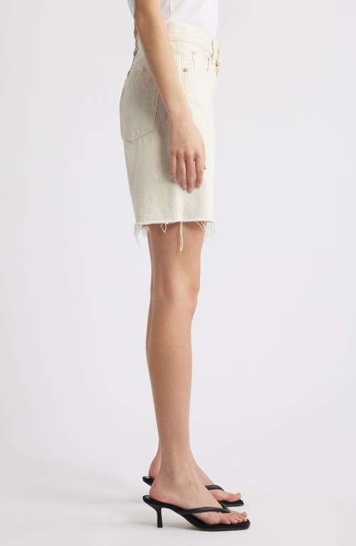 Shop Frame The Timeless Cutoff Denim Shorts In Milkshake