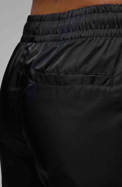 Shop Jordan Brooklyn Water Repellent Pants In Black/white