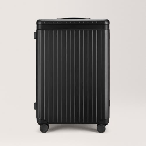 Carl Friedrik The Check-in Suitcase In Black/black