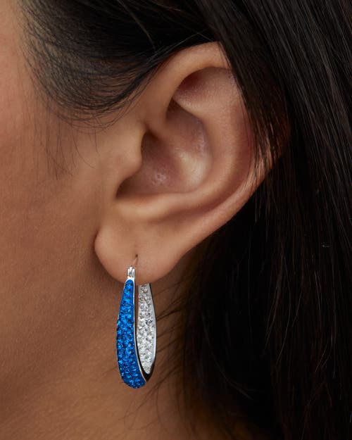 Crystalogy Blue And Clear Crystal Inside Out Oval Hoop Earrings In Metallic