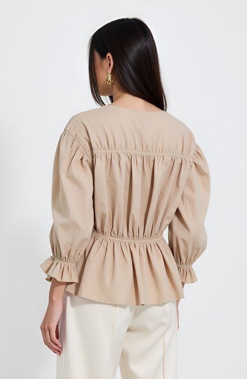 Modenaire Gathered Peplum Tie-front Puff-sleeve Blouse In Nude