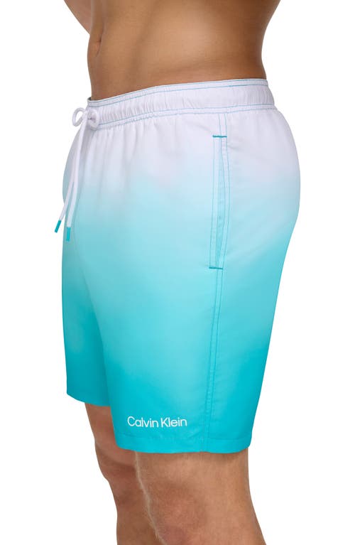 Shop Calvin Klein Sky Gradient Swim Trunks In Atlantis