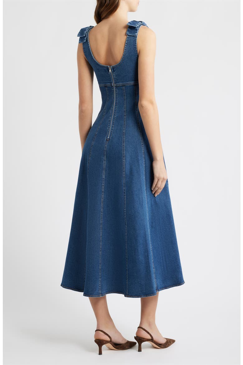 cotton denim dress Sleeveless A-shape made from an organic cotton-lyocell mix Complete with an engraved metal bar at the hem. Petal and Pup Women's Odelia