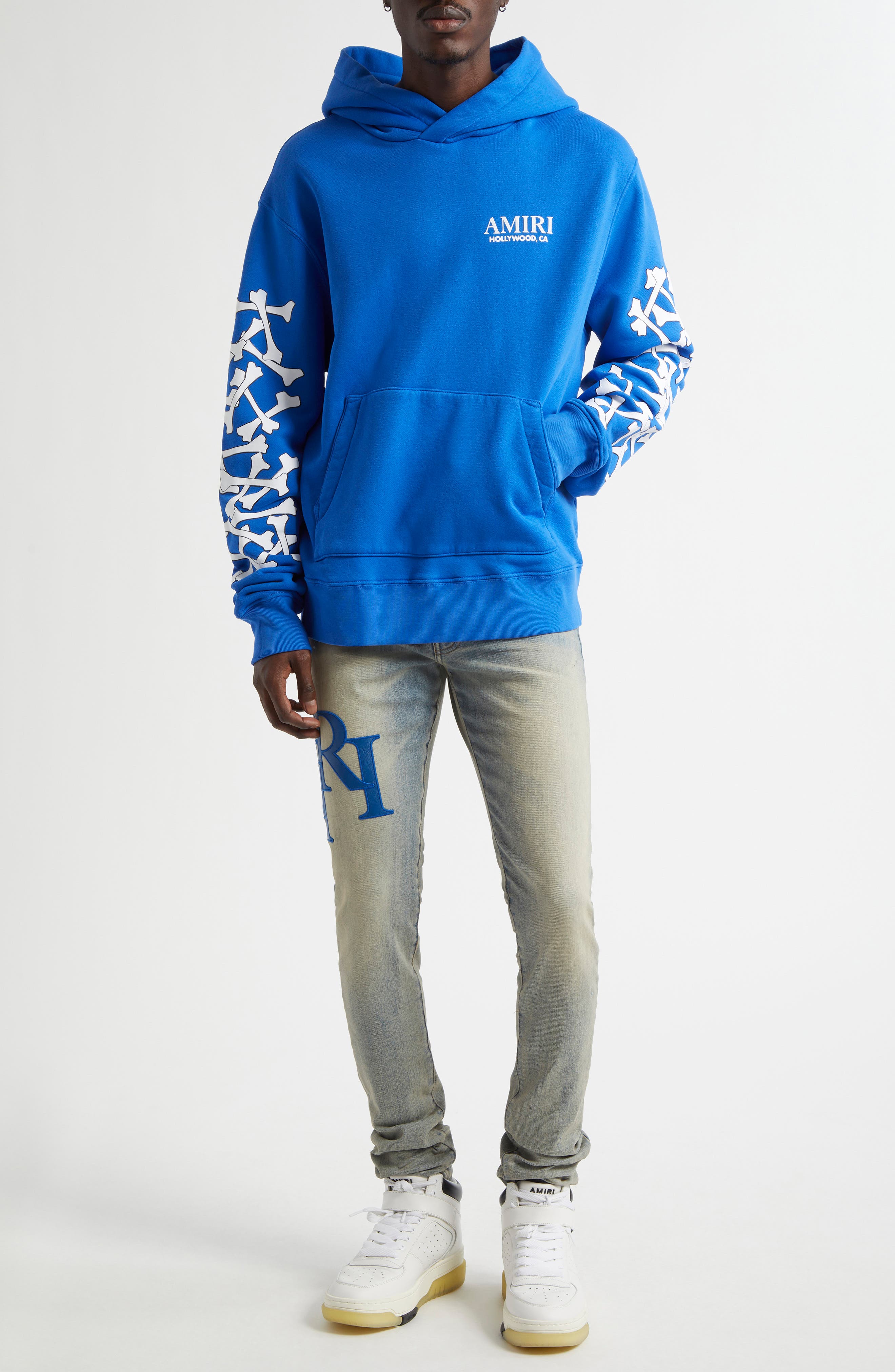 AMIRI Staggered Logo Skinny Jeans (Men) | Nordstrom
