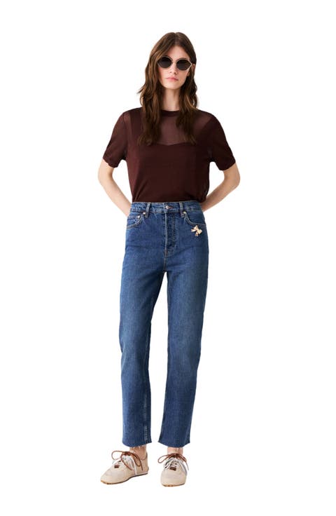 Skinny jeans with brooch