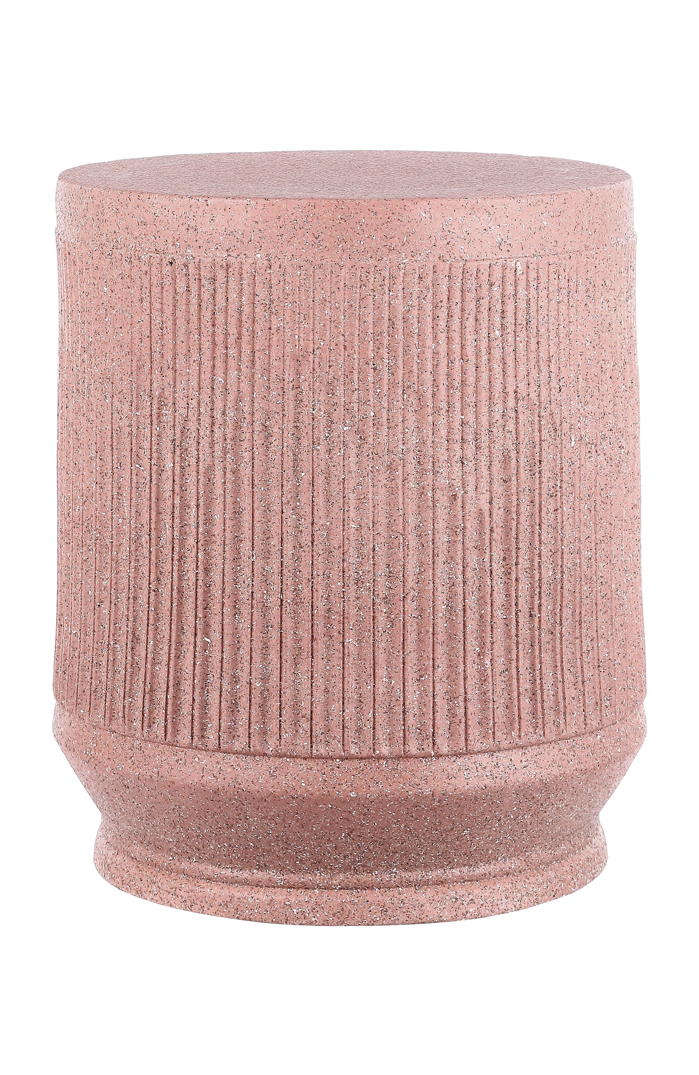Pink cylindrical side table with ribbed texture