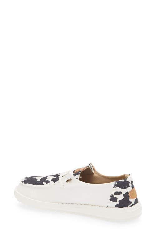 Hey Dude Wendy Animal Print Slip-on Moc Toe Shoe In White/black Cow Print