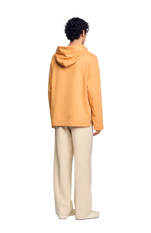 Sandro Graphic Oversized Pullover Hoodie In Mandarin.