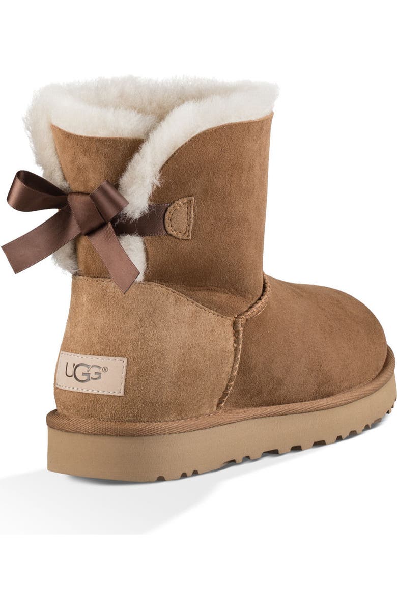 UGG<sup>®</sup> Mini Bailey Bow II Genuine Shearling Bootie, Alternate, color, Chestnut Suede
