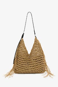 A straw shoulder bag with tassels. 