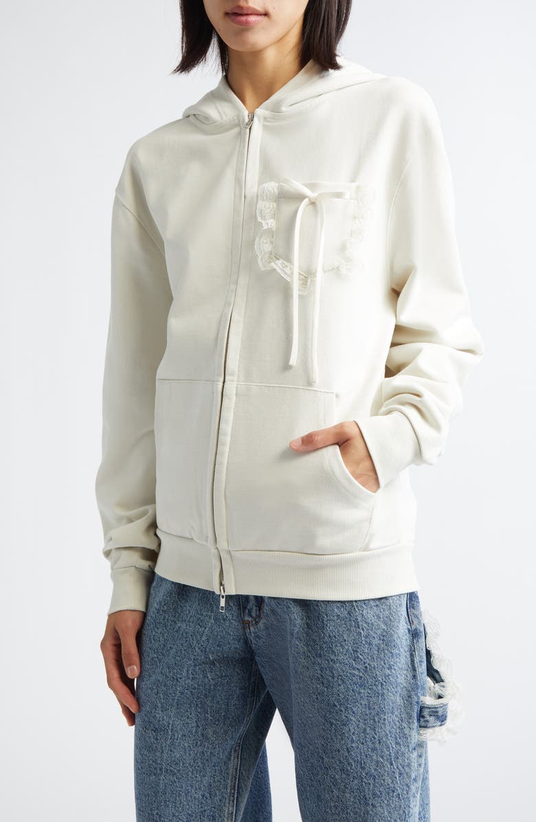 Tanner Fletcher Gender Inclusive Bennett Bow Pocket Cotton Zip-Up Hoodie, Main, color, Ivory