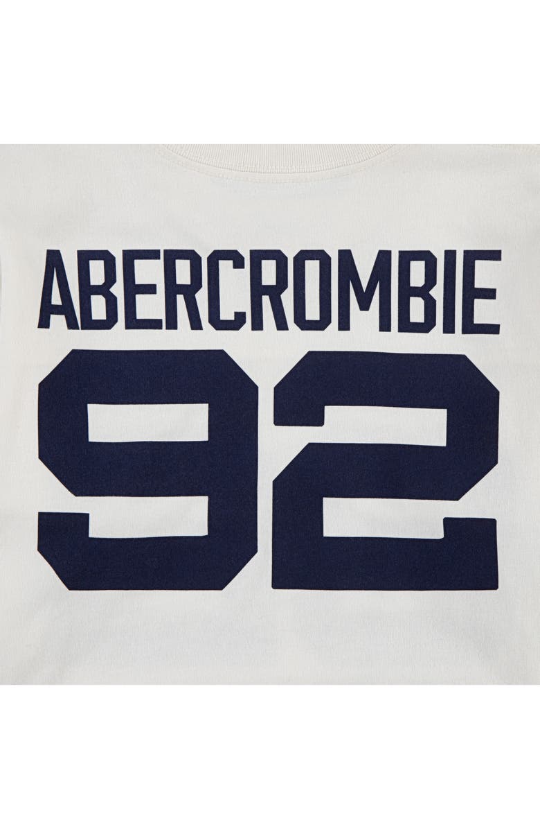 abercrombie kids Kids' Long Sleeve Football Hangdown Graphic T-Shirt, Alternate, color, Jet Stream