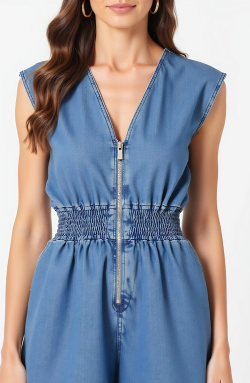 Modenaire Denim Romper With Cap Sleeves Smocked Waist And Front Zip Closure In Blue