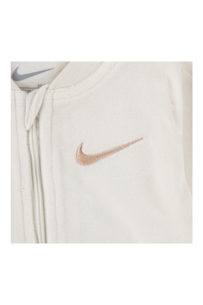 Essentials Swoosh Print Velour Footie<br /><br /><br /><br /><br /><br /><br /><br /><br /><br /><br /><br /><br /><br /><br /><br /><br /><br /><br /><br /><br /><br /><br /><br />Essentials Fleece Footie, Alternate, color, PALE IVORY