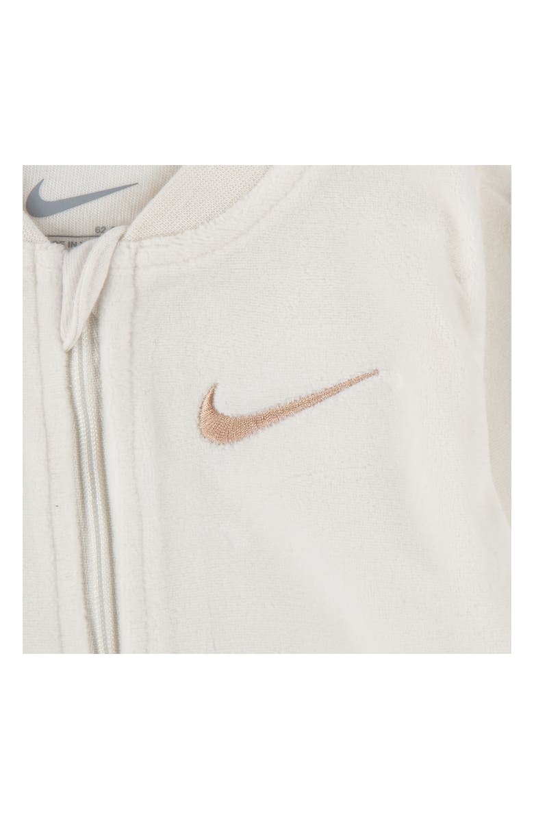 Nike Essentials Swoosh Print Velour Footie<br /><br /><br /><br /><br /><br /><br /><br /><br /><br /><br /><br /><br /><br /><br /><br /><br /><br /><br /><br /><br /><br /><br /><br />Essentials Fleece Footie, Alternate, color, Pale Ivory