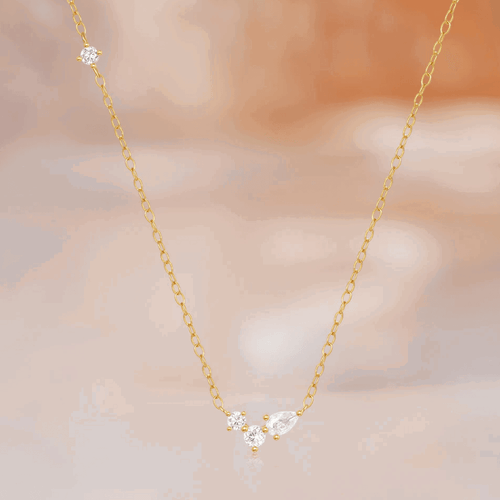 Hollywood Sensation Orlina Delicate Necklace With Three Round And One Pear Cut Cubic Zirconia Stones In Gold