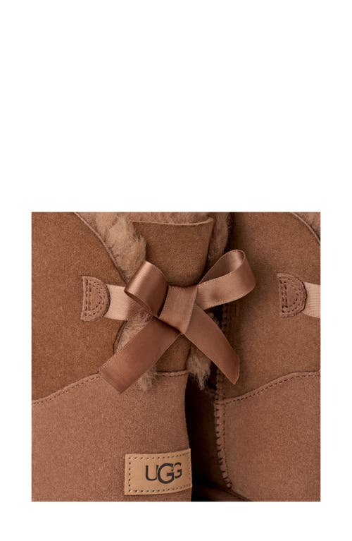 Ugg(r) Mini Bailey Bow Ii Genuine Shearling Bootie In Brown