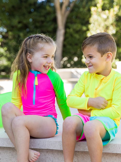 Rufflebutts Girls Upf50+ Sun Protection Long Sleeve Rash Guard One Piece In Neon Color Block