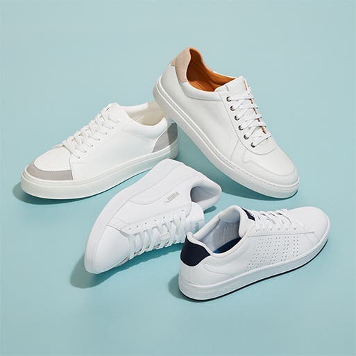 A variety of white sneakers.