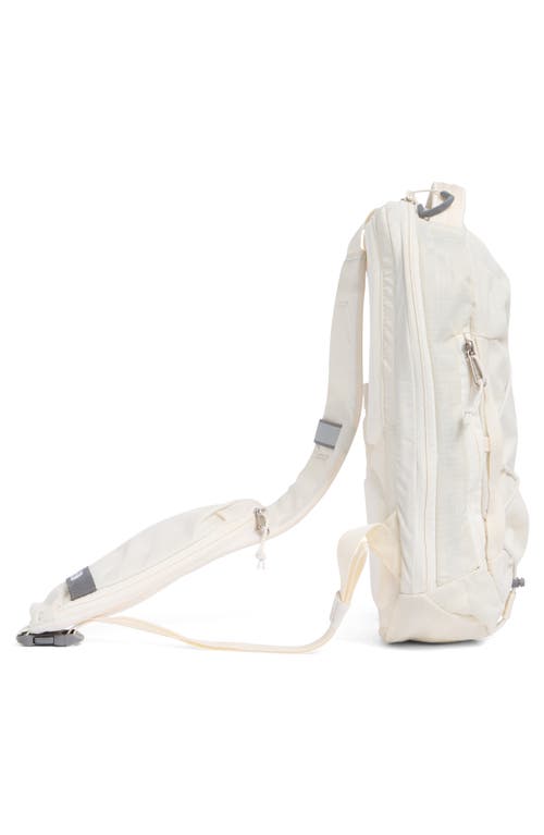 Shop The North Face Borealis Water Repellent Sling Backpack In White Dune/gravel