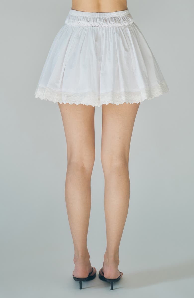 MAUDE CLUB Austin Embroidered Hem Cotton Miniskirt, Alternate, color, White