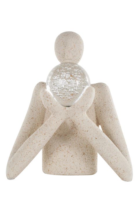 Human with Glass Ball Sculpture