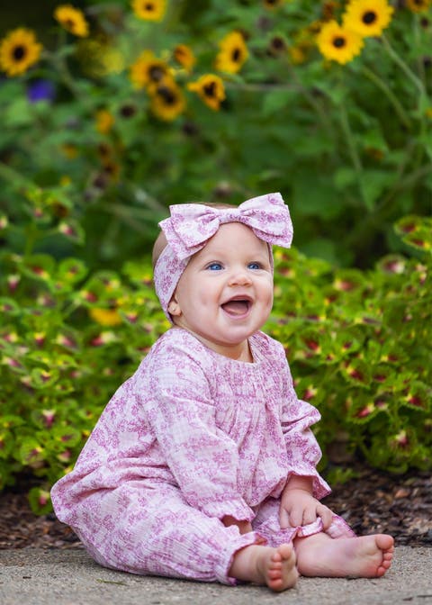 Loretta Long Sleeve Floral Smocked Ruffle Leg Romper