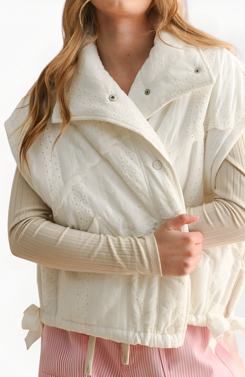 Modenaire Quilted Sleeveless Vest With Snap Front And Side Ties In White