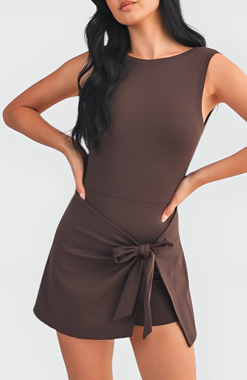 Modenaire Sleeveless Active Romper With Side Tie Skirt Overlay And Scoop Neckline In Brown