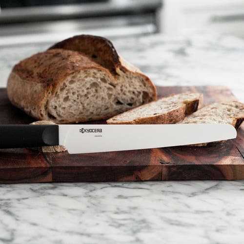 Kyocera Innovationwhite 7-inch Ceramic Bread Knife, White Micro Serrated Blade With Non-slip Black H In Black