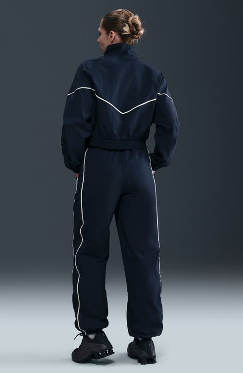 Nike Sportswear Windrunner Water Repellent Track Pants In Blue