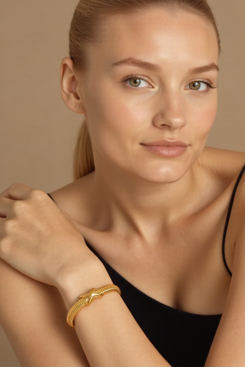 Akalia Stylish Waterproof Love Twist Bracelet With Gold Plating In Gold