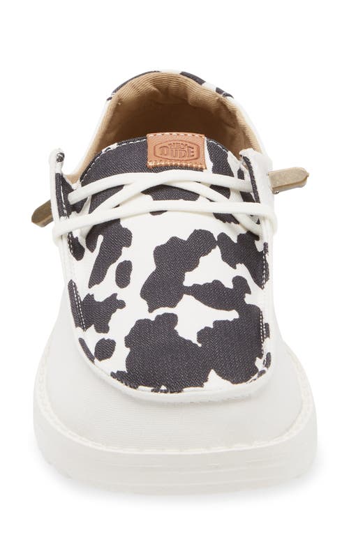 Hey Dude Wendy Animal Print Slip-on Moc Toe Shoe In White/black Cow Print