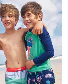Boys wearing Mini Boden swimwear.