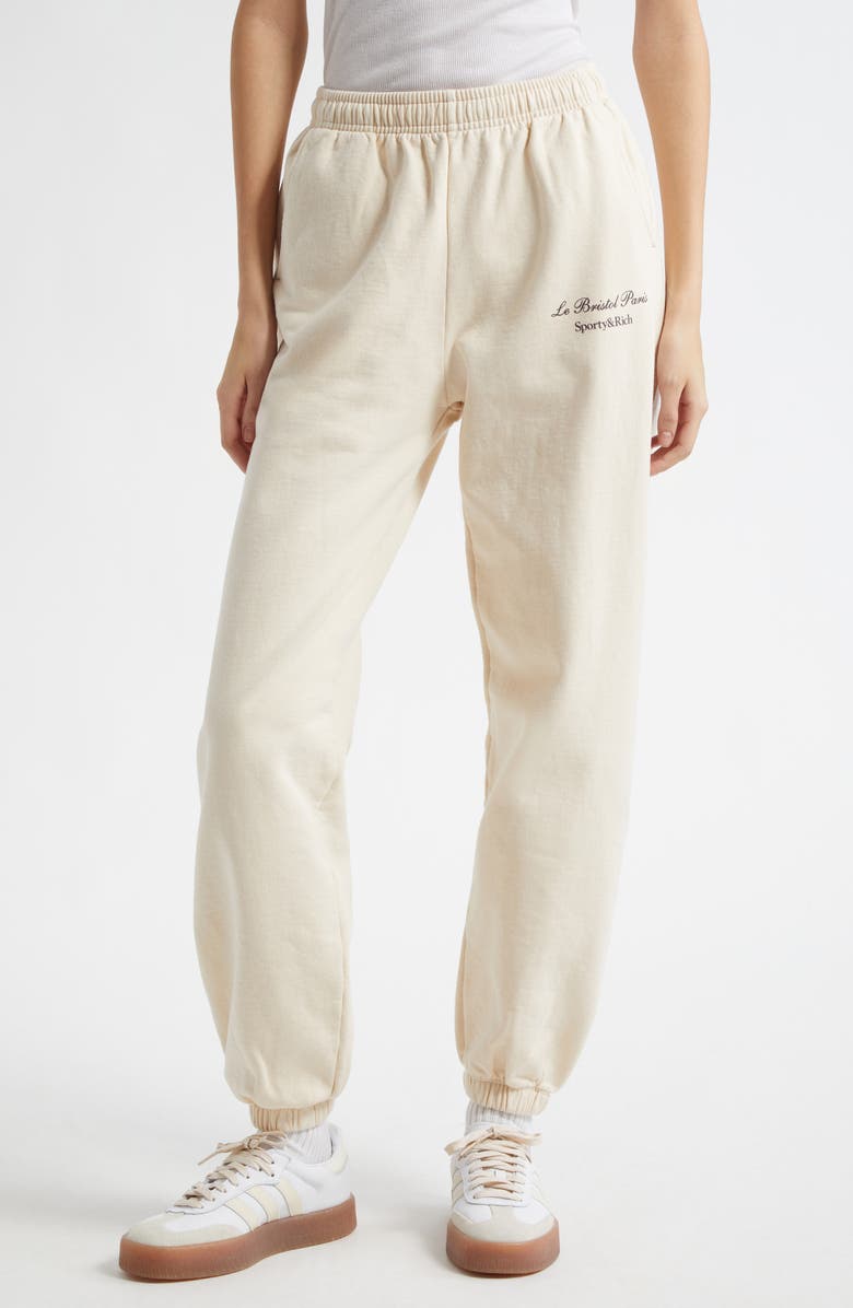 Sporty & Rich x Le Bristol Paris Faubourg Logo Cotton Joggers, Main, color, Cream