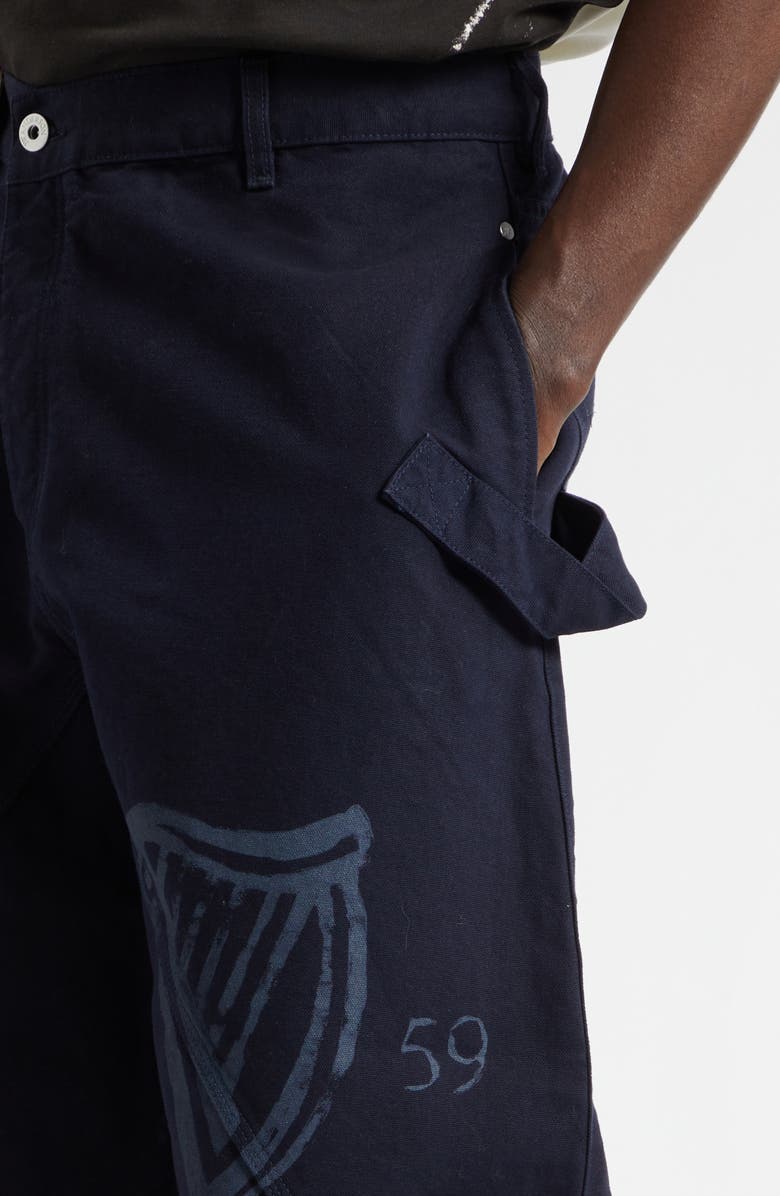 JW Anderson x Guinness Twisted Cotton Canvas Workwear Pants, Alternate, color, Indigo