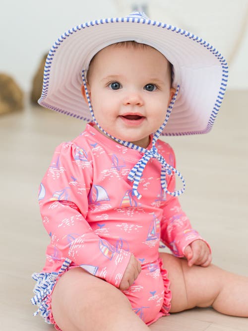 Rufflebutts Toddler Girls Long Sleeve Upf50+ One Piece Rash Guard In Pink Seas The Day