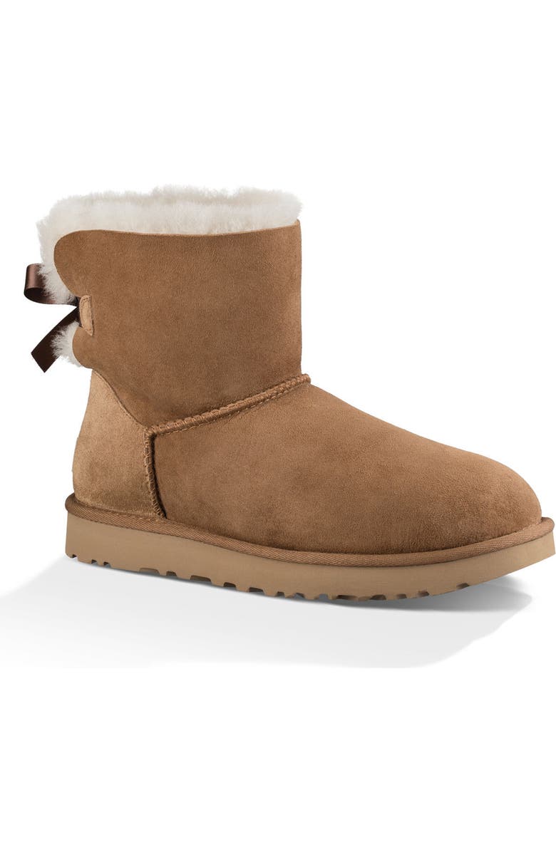 UGG<sup>®</sup> Mini Bailey Bow II Genuine Shearling Bootie, Main, color, Chestnut Suede