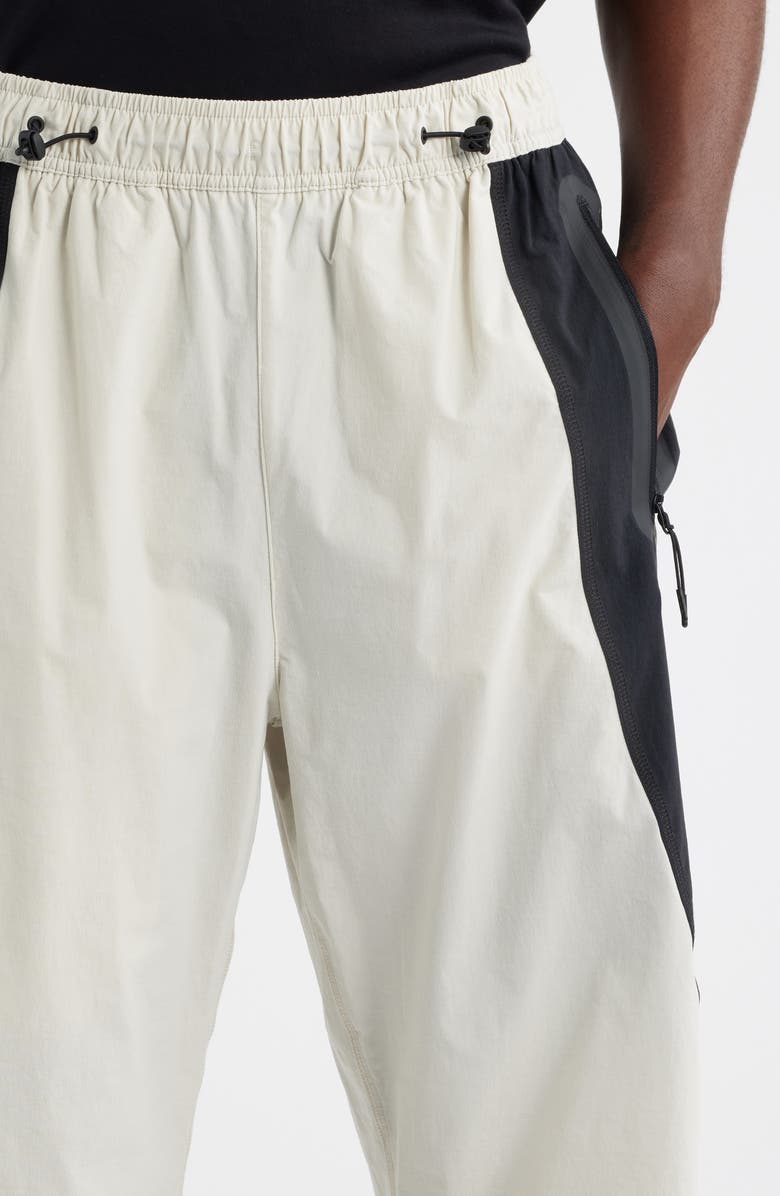 Nike Tech Dri-FIT Woven Oversize Stretch Nylon Pants, Alternate, color, Light Bone/ Black