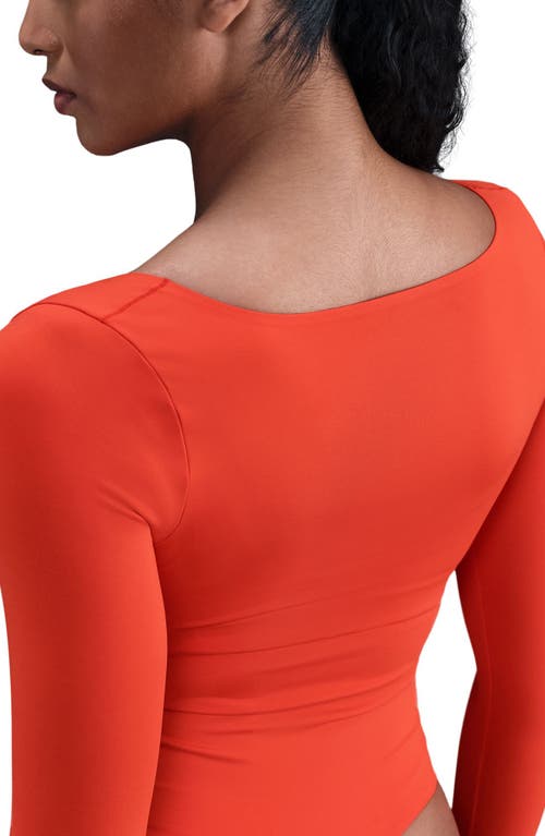 Nike Dri-fit Long Sleeve Bodysuit In Gold