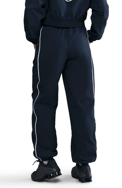 Nike Sportswear Windrunner Water Repellent Track Pants In Blue