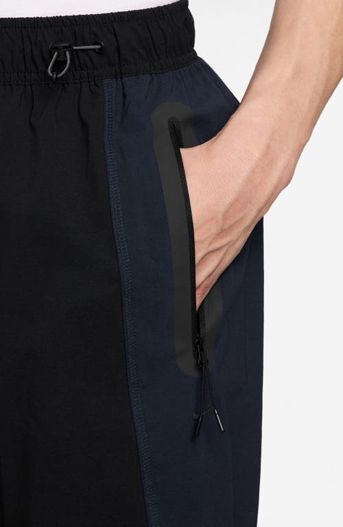 Nike Tech Dri-fit Woven Oversize Stretch Nylon Pants In Black