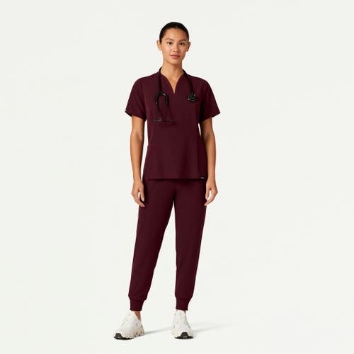 Jaanuu 2-pocket Tailored V-neck Scrub Top In Burgundy