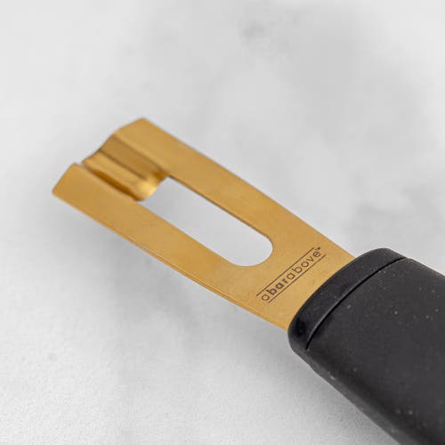 A Bar Above Gold Channel Knife, Black Handle In Gold