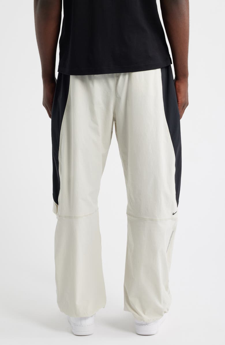 Nike Tech Dri-FIT Woven Oversize Stretch Nylon Pants, Alternate, color, Light Bone/ Black