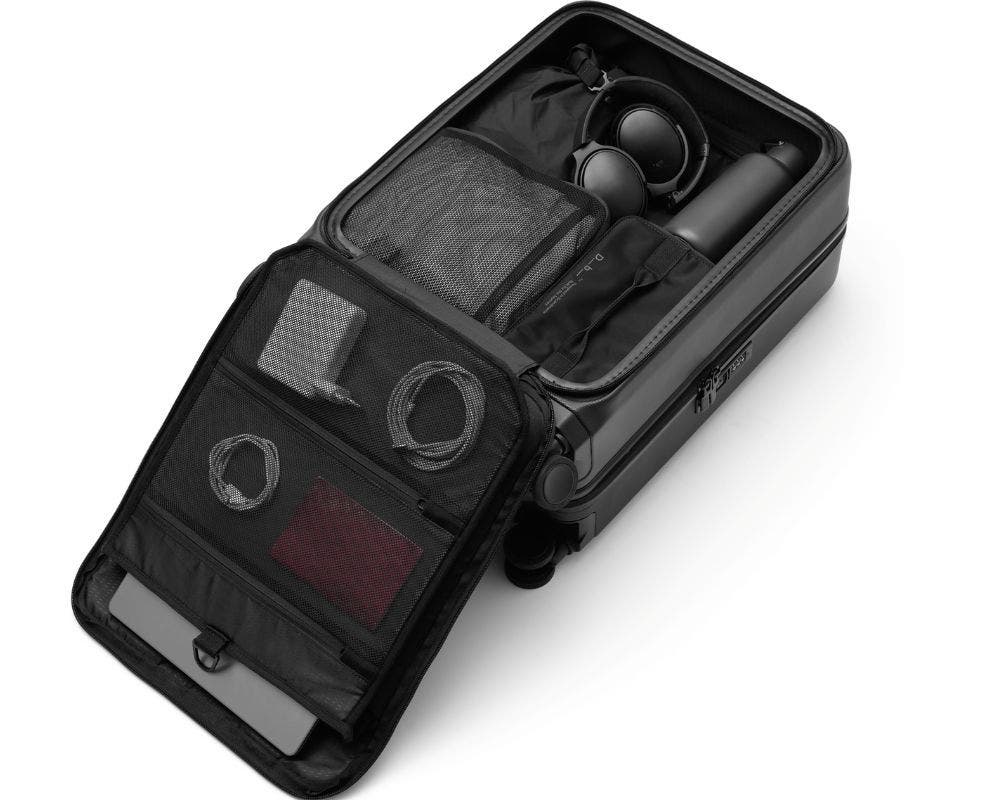 D_b_ Ramverk Pro Hardside 21 Inch Carry On Luggage  Spinner with Zipper Front Access Pocket, Alternate, color, Black Out