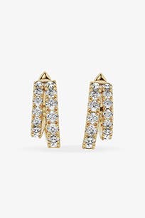 Gold hoop earrings with lab-created diamonds.