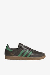 Black leather sneaker with green stripes.
