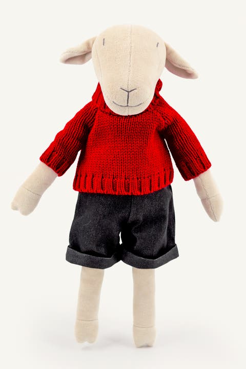 Maia, the sheep stuffed animal with red Pullover and Jeans